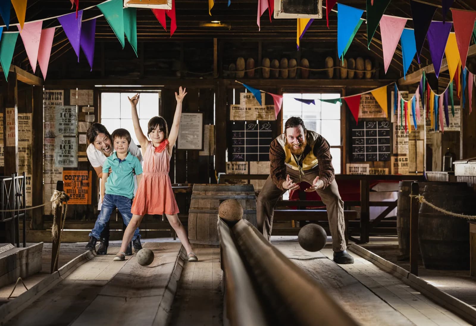 Family playing old fashion bowling