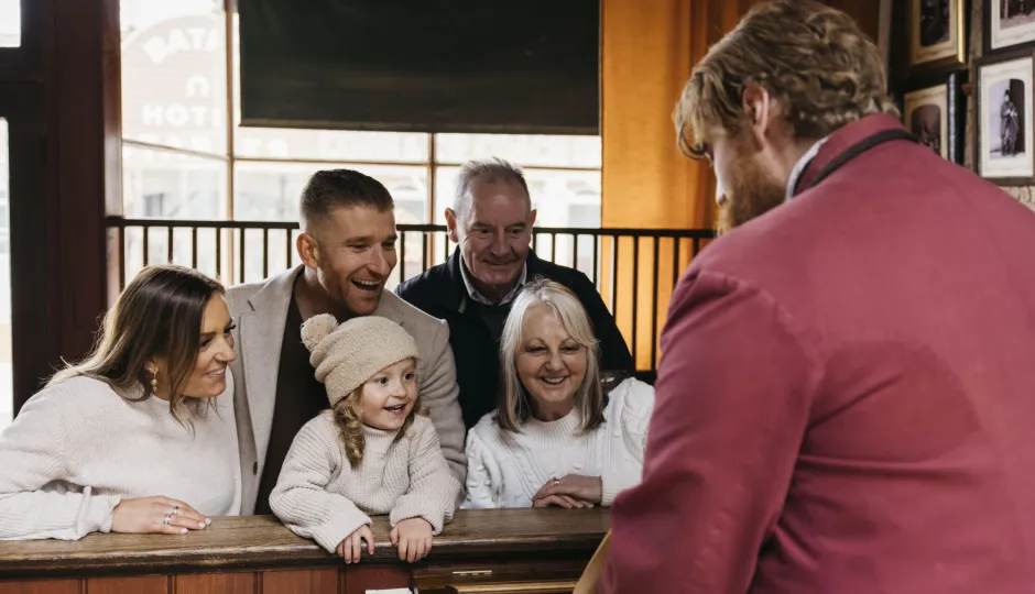Family watching a man