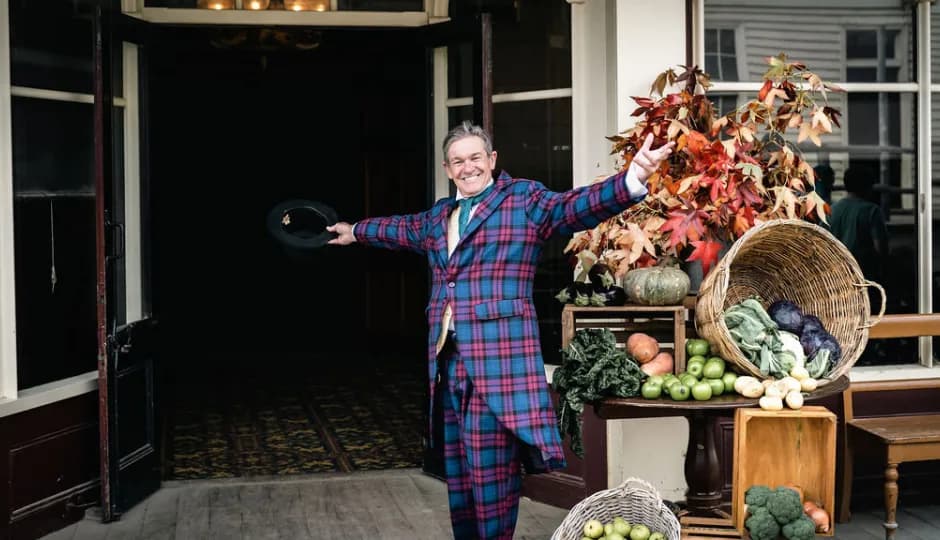 Man in costume with arms wide open
