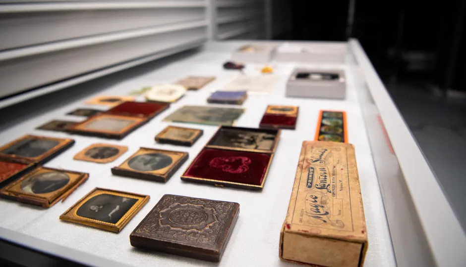 Collection of historical items at the Australian Centre for Gold Rush Collections, showcasing old photographic techniques and artifacts in a museum storage drawer.