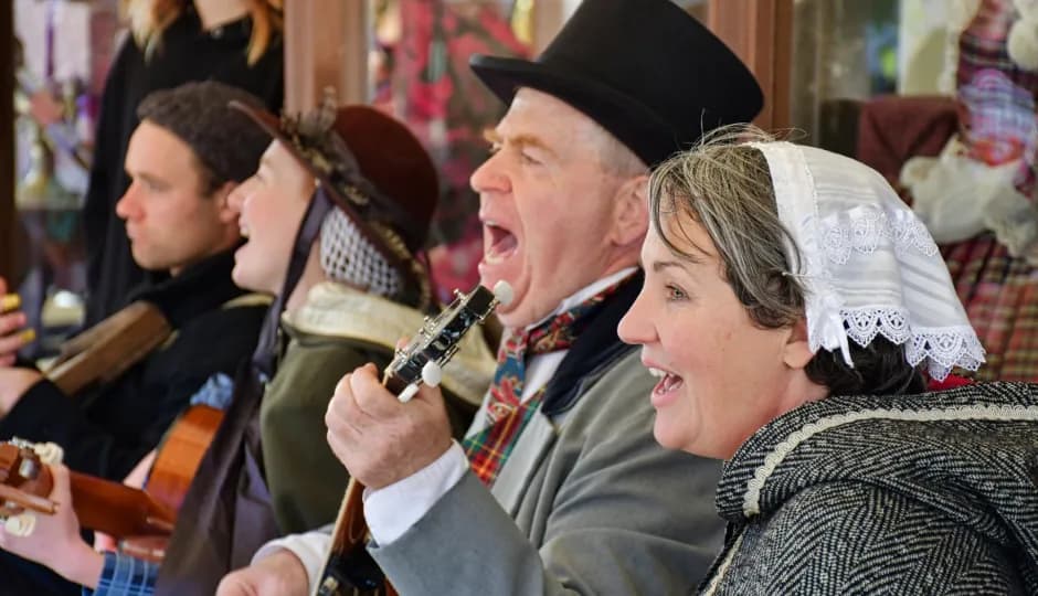 People in costume singing and playing instruments