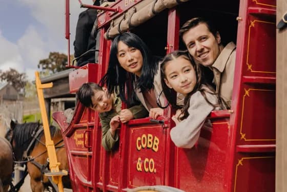 Family in horse-drawn carriage