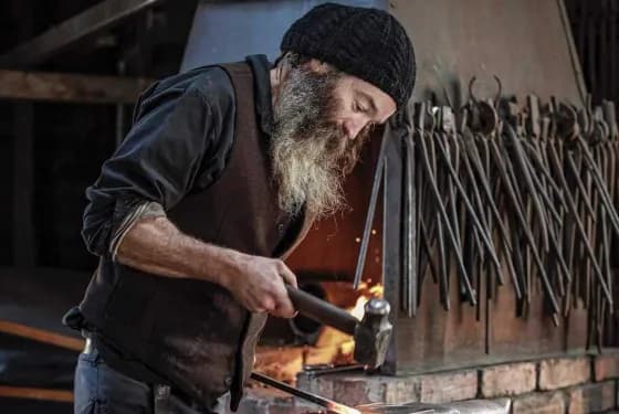Blacksmith with a hammer and anvil