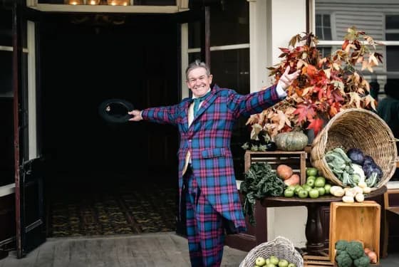Man in costume with arms wide open