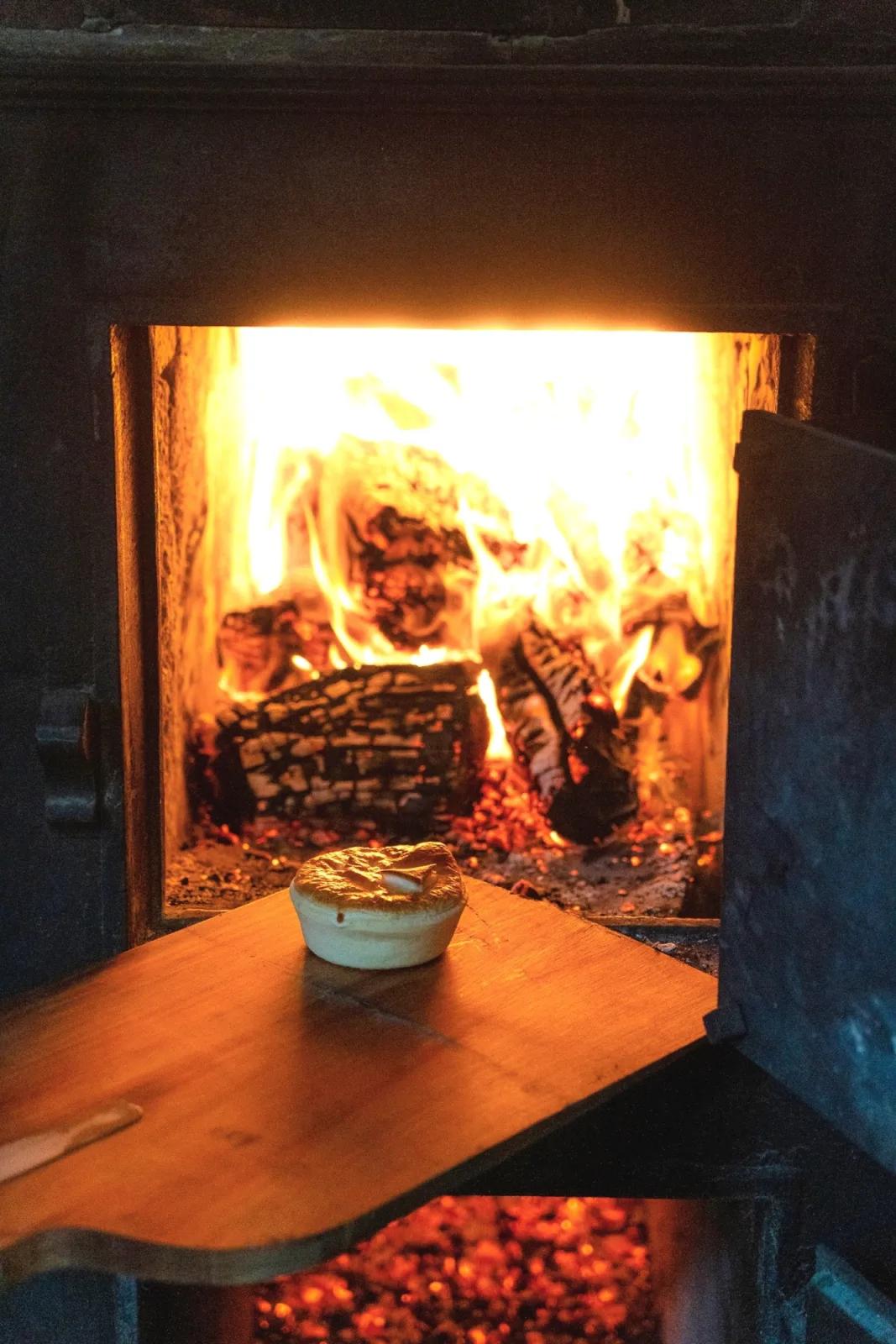 A pie near the wood fire oven