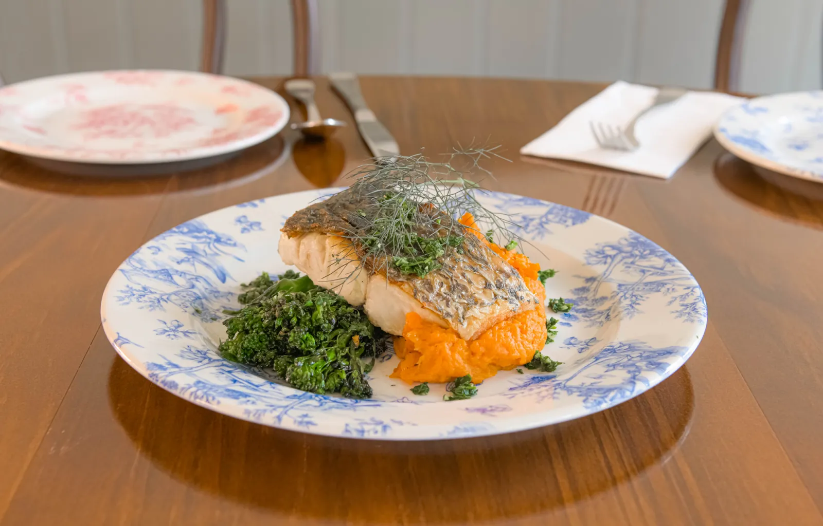 Fish with sweet potato mash and vegetables