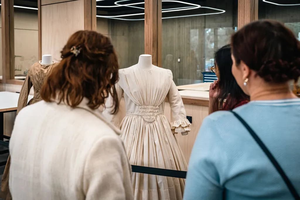 Ladies admiring mannequin with a dress