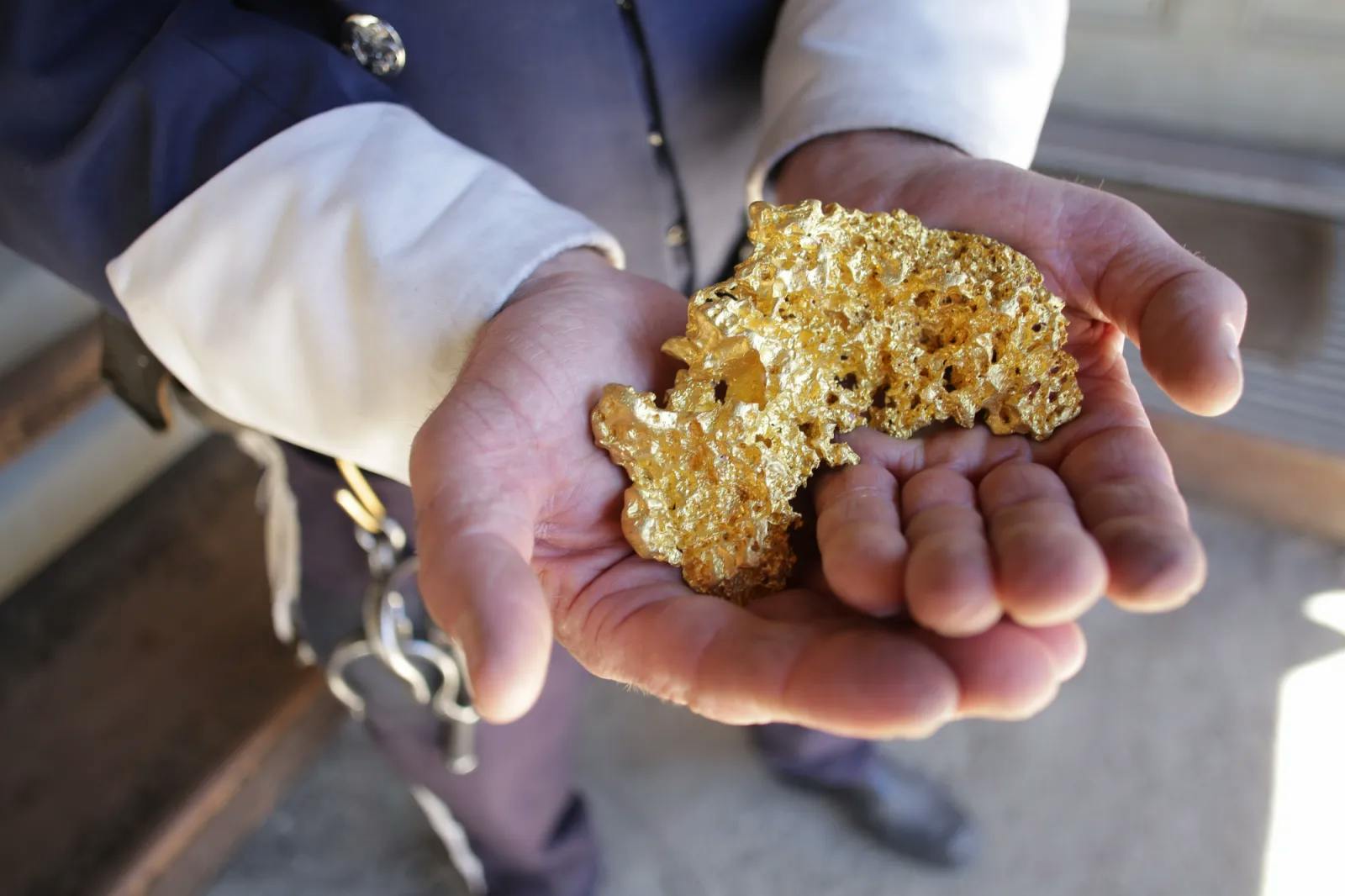 Person holding gold nugget