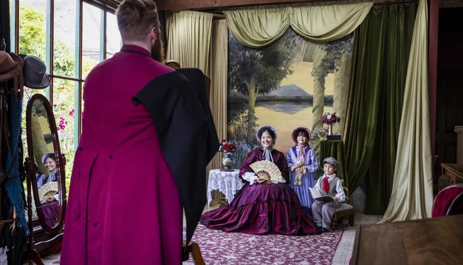 Man taking photo of family