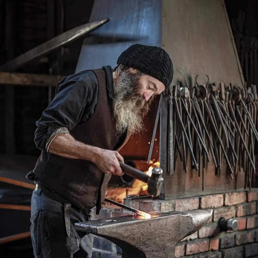 Blacksmith with a hammer and anvil