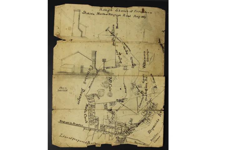 Hand-drawn rough sketch of Eurambeen Station from the Beggs family collection, showing buildings, roads, paddocks and a proposed railway line.