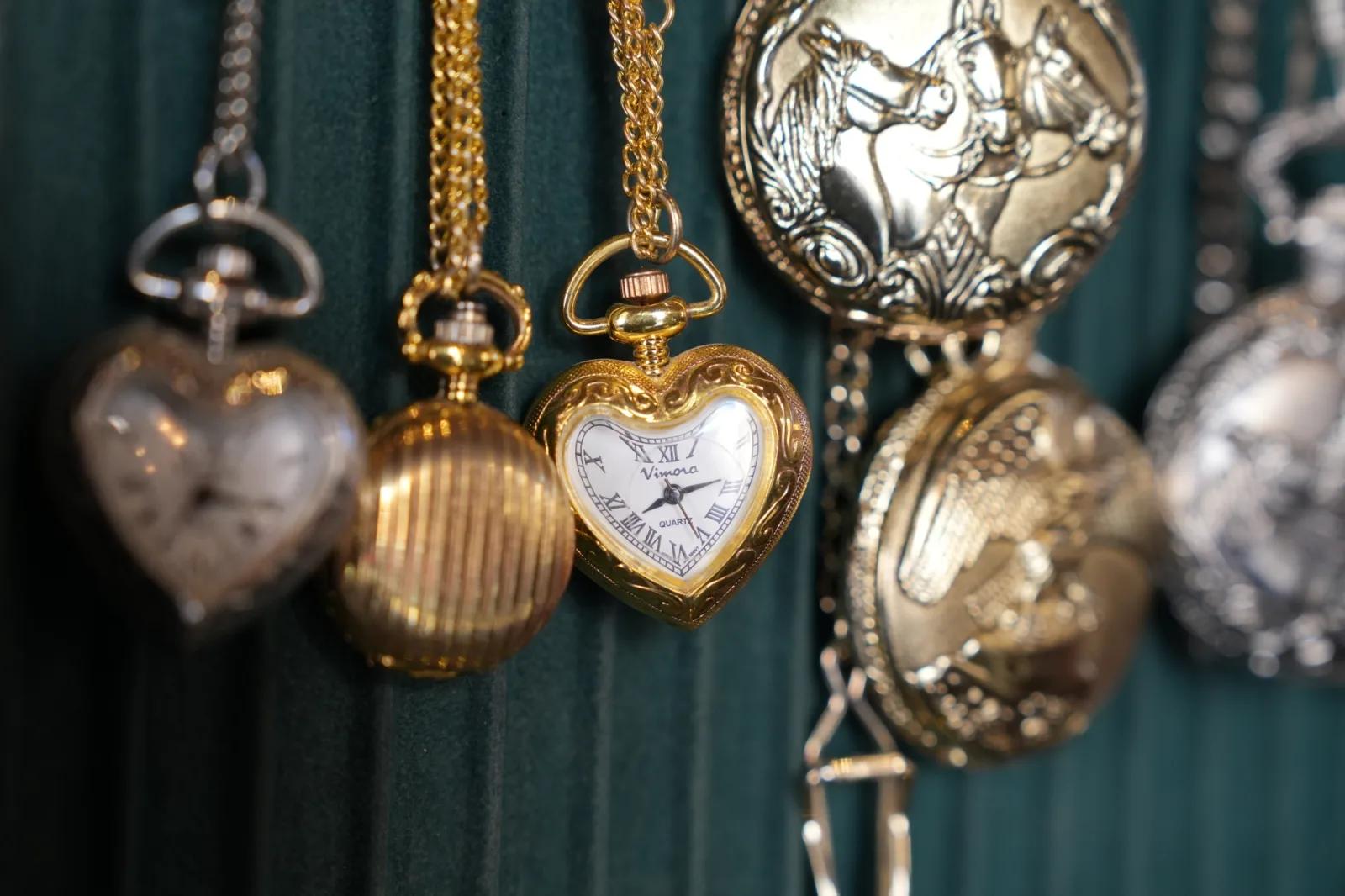 Ornate gold and silver pocket watches displayed at Rees Benjamin Jewellers in Sovereign Hill.
