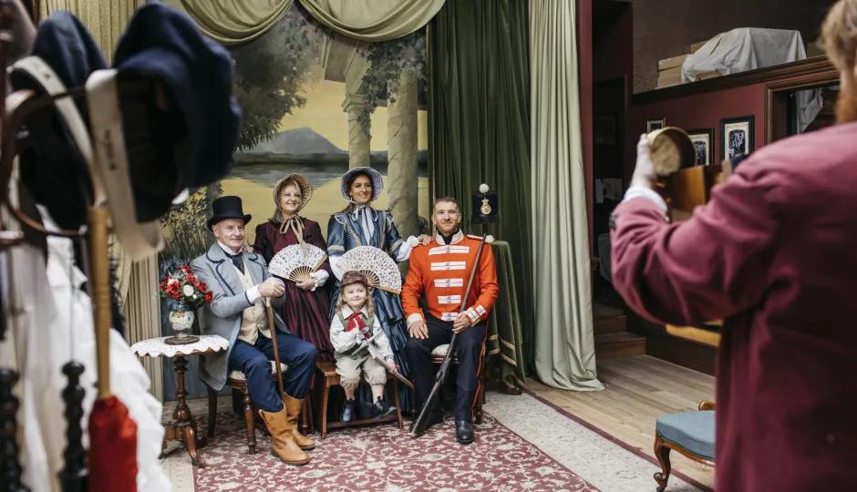 Man taking family portrait